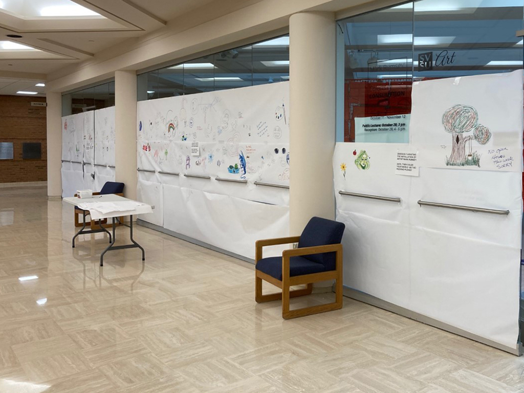 Banner drawing wall for student interaction before the Rumsey exhibit opened.